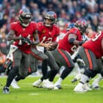 Tom Brady #12 of the Tampa Bay Buccaneers prepares to pass the ball during the NFL match between Seattle Seahawks and Tampa Bay Buccaneers at Allianz Arena on November 13, 2022 in Munich, Germany.