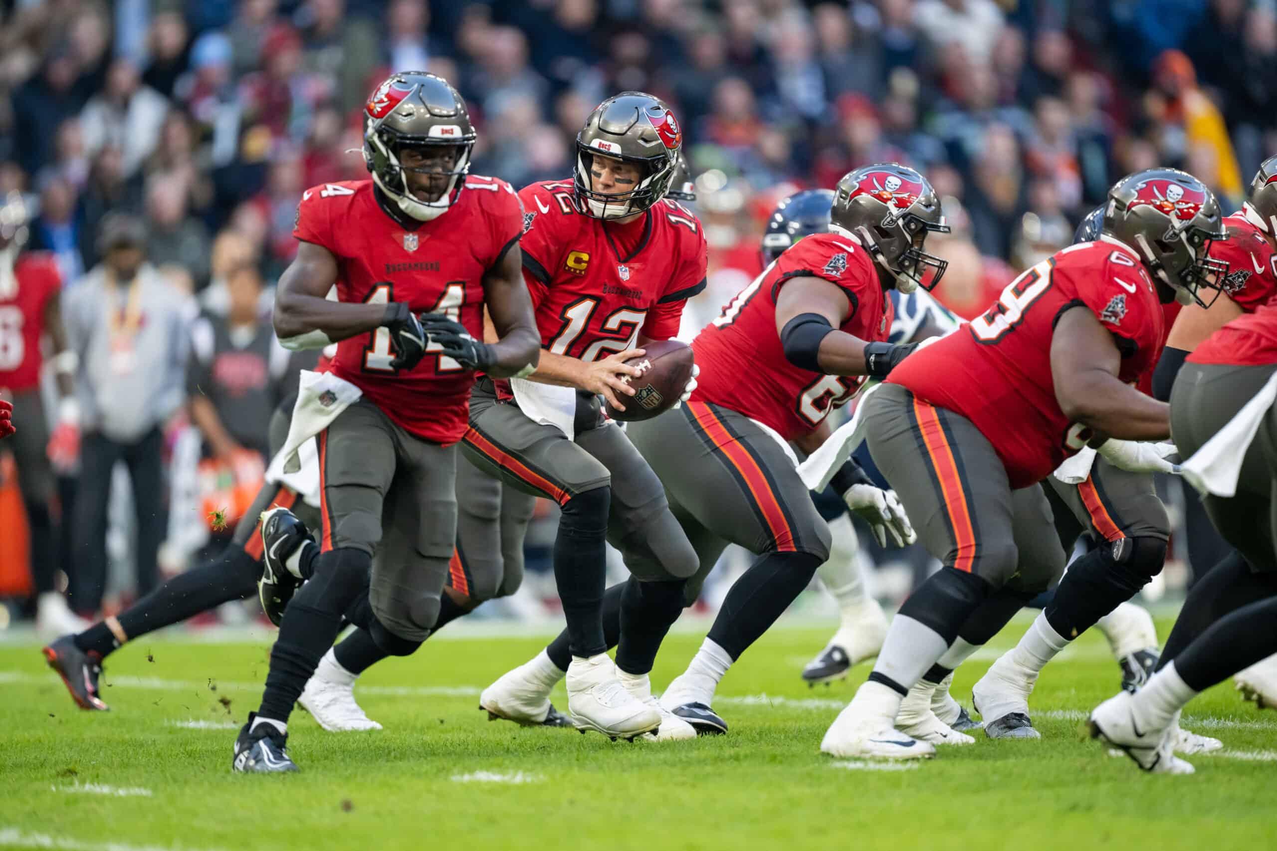 Tom Brady #12 of the Tampa Bay Buccaneers prepares to pass the ball during the NFL match between Seattle Seahawks and Tampa Bay Buccaneers at Allianz Arena on November 13, 2022 in Munich, Germany.