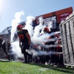 Wyatt Teller #77 of the Cleveland Browns runs on to the field with teammates prior to the game against the Los Angeles Chargers at FirstEnergy Stadium on October 09, 2022 in Cleveland, Ohio.