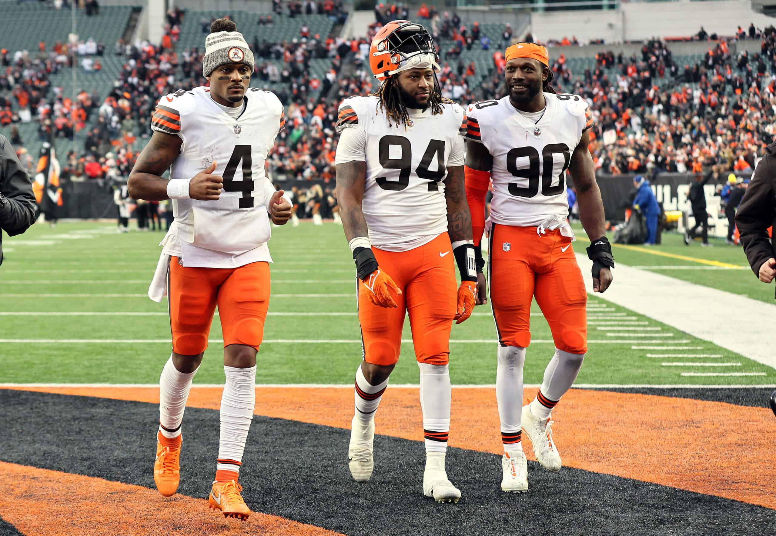 Deshaun Watson #4, Alex Wright #94 and Jadeveon Clowney #90 of the Cleveland Browns walk off the field after a game against the Cincinnati Bengals at Paycor Stadium on December 11, 2022 in Cincinnati, Ohio. (