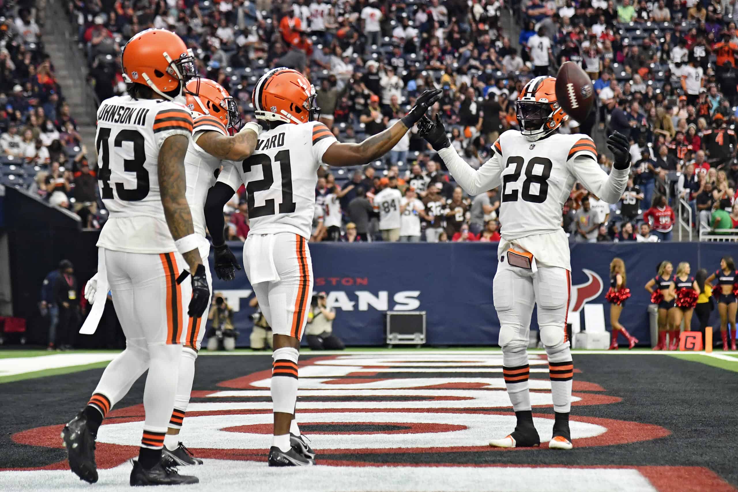 Denzel Ward #21 of the Cleveland Browns celebrates with Jeremiah Owusu-Koramoah #28 of the Cleveland Browns after Ward's fumble recovery for a touchdown during the third quarter against the Houston Texans at NRG Stadium on December 04, 2022 in Houston, Texas.