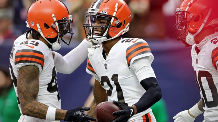 Denzel Ward #21 of the Cleveland Browns celebrates after his fumble recovery for a touchdown during the third quarter against the Houston Texans at NRG Stadium on December 04, 2022 in Houston, Texas.