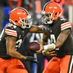 Deshaun Watson #4 of the Cleveland Browns hands the ball off to Nick Chubb #24 during the first quarter against the Baltimore Ravens at FirstEnergy Stadium on December 17, 2022 in Cleveland, Ohio.