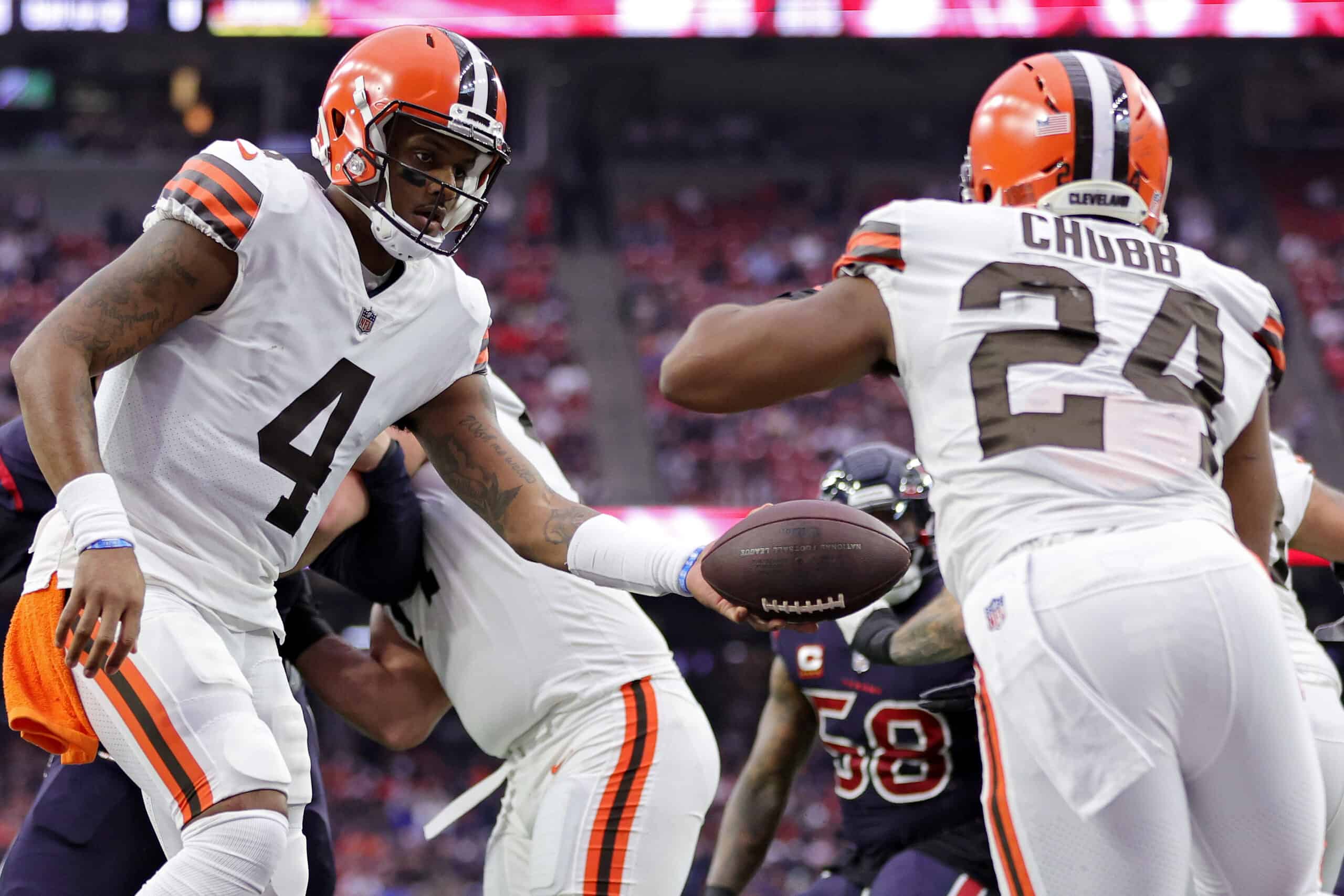 Deshaun Watson #4 of the Cleveland Browns hands the ball off to Nick Chubb #24 of the Cleveland Browns during the second quarter against the Houston Texans at NRG Stadium on December 04, 2022 in Houston, Texas.