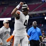 Deshaun Watson #4 of the Cleveland Browns gestures while running off the field following his team's 27-14 win over the Houston Texans at NRG Stadium on December 04, 2022 in Houston, Texas.