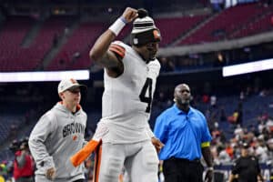 Deshaun Watson #4 of the Cleveland Browns gestures while running off the field following his team's 27-14 win over the Houston Texans at NRG Stadium on December 04, 2022 in Houston, Texas.