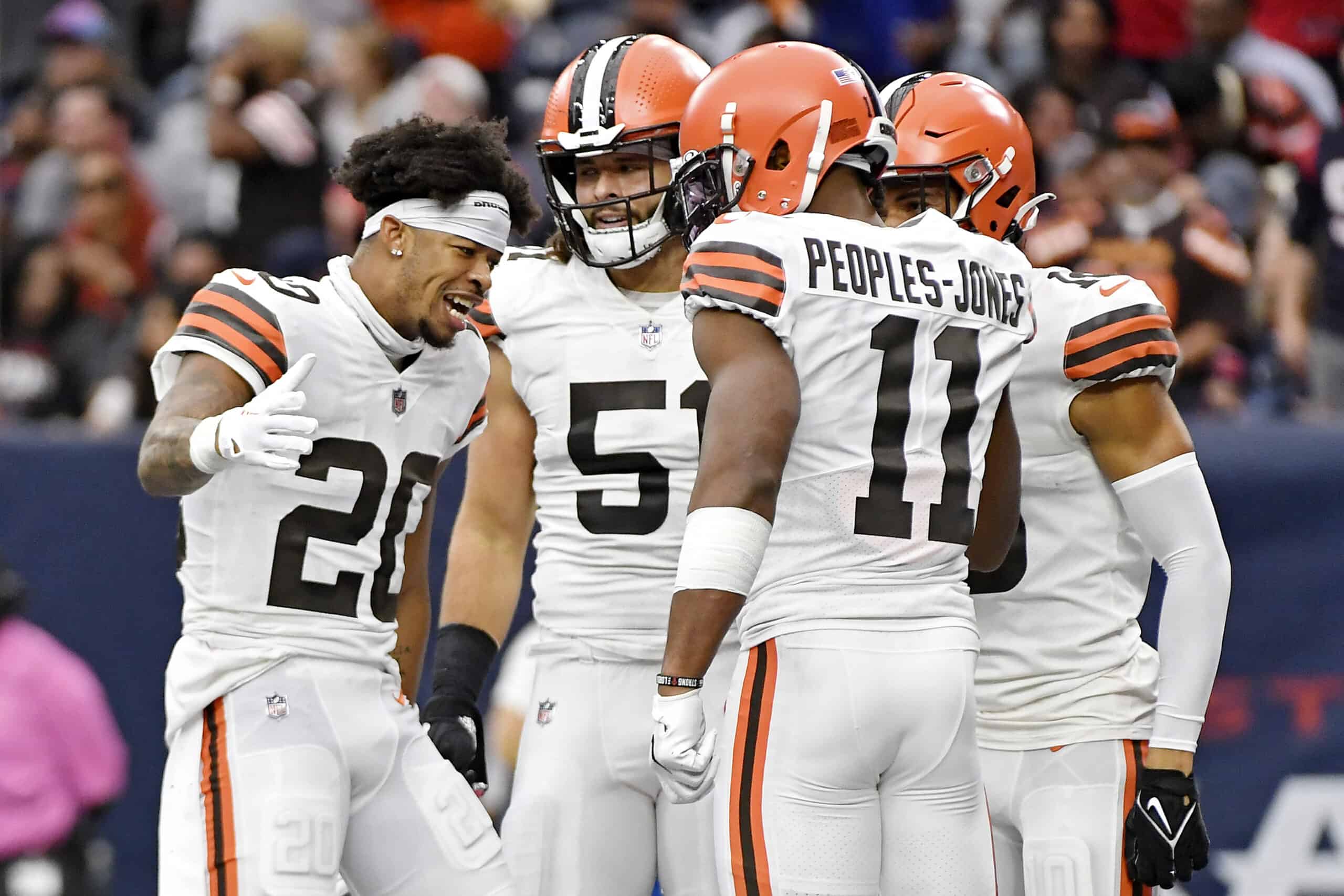 Greg Newsome II #20 of the Cleveland Browns celebrates with Donovan Peoples-Jones #11 of the Cleveland Browns after Peoples-Jones' punt return for a touchdown during the second quarter against the Houston Texans at NRG Stadium on December 04, 2022 in Houston, Texas.