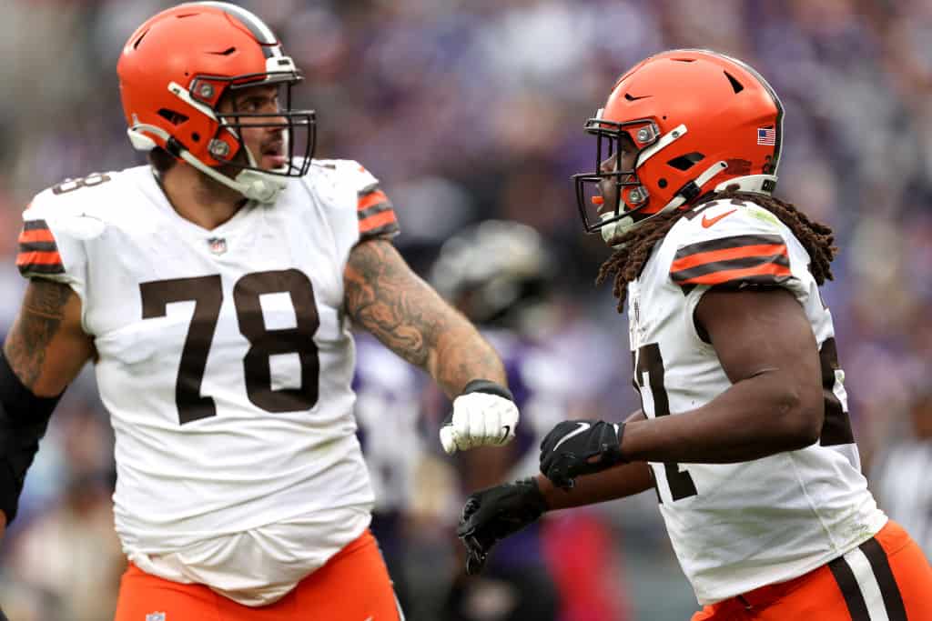 BALTIMORE, MARYLAND - OCTOBER 23: Kareem Hunt #27 of the Cleveland Browns celebrates with Jack Conklin #78 after rushing for a touchdown during the fourth quarter of the game against the Baltimore Ravens at M&T Bank Stadium on October 23, 2022 in Baltimore, Maryland.