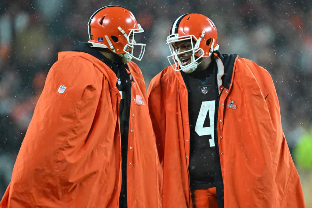 CLEVELAND, OHIO - DECEMBER 17: Deshaun Watson #4 and Jacoby Brissett #7 of the Cleveland Browns talk on the sidelines during the fourth quarter against the Baltimore Ravens at FirstEnergy Stadium on December 17, 2022 in Cleveland, Ohio