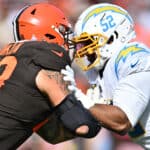 Khalil Mack #52 of the Los Angeles Chargers defends against Jack Conklin #78 of the Cleveland Browns during the second half at FirstEnergy Stadium on October 09, 2022 in Cleveland, Ohio.