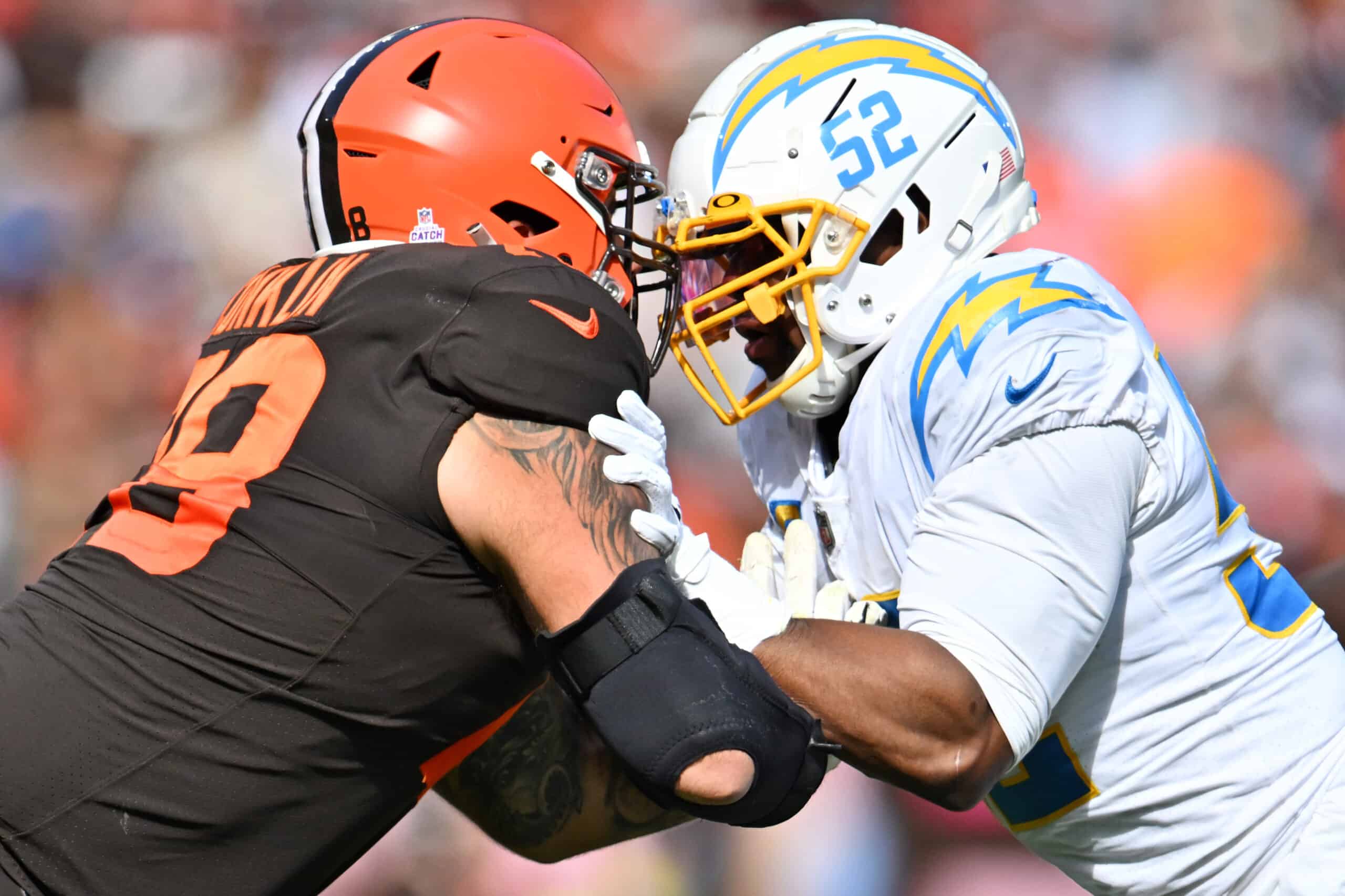 Khalil Mack #52 of the Los Angeles Chargers defends against Jack Conklin #78 of the Cleveland Browns during the second half at FirstEnergy Stadium on October 09, 2022 in Cleveland, Ohio. 