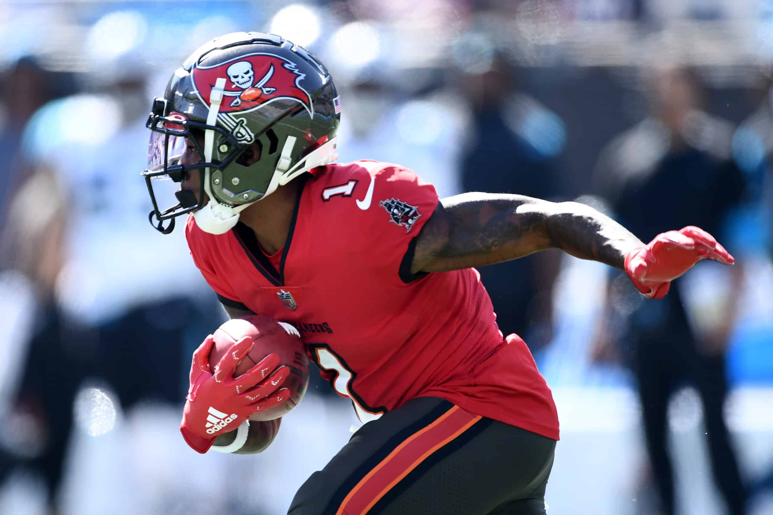 Jaelon Darden #1 of the Tampa Bay Buccaneers runs with the ball after catching a punt in the first quarter against the Carolina Panthers at Bank of America Stadium on October 23, 2022 in Charlotte, North Carolina.