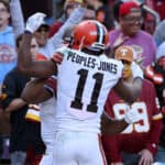 Amari Cooper #2 of the Cleveland Browns celebrates with Donovan Peoples-Jones #11 of the Cleveland Browns after scoring a touchdown during the fourth quarter against the Washington Commanders at FedExField on January 01, 2023 in Landover, Maryland.