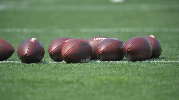 BEREA, OHIO - JULY 28: Footballs lay on the field during the first day of Cleveland Browns Training Camp on July 28, 2021 in Berea, Ohio.