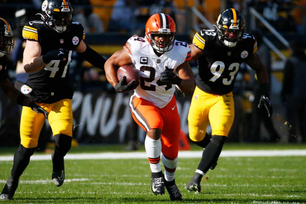 PITTSBURGH, PENNSYLVANIA - JANUARY 08: Nick Chubb #24 of the Cleveland Browns runs with the ball during the first half of the game against the Pittsburgh Steelers at Acrisure Stadium on January 08, 2023 in Pittsburgh, Pennsylvania.