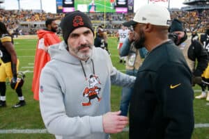 PITTSBURGH, PENNSYLVANIA - JANUARY 08: Head coach Kevin Stefanski of the Cleveland Browns talks with head coach Mike Tomlin of the Pittsburgh Steelers after the game at Acrisure Stadium on January 08, 2023 in Pittsburgh, Pennsylvania.