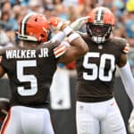 Anthony Walker Jr. #5 of the Cleveland Browns and Jacob Phillips #50 celebrate a defensive play during the second quarter against the Carolina Panthers at Bank of America Stadium on September 11, 2022 in Charlotte, North Carolina.