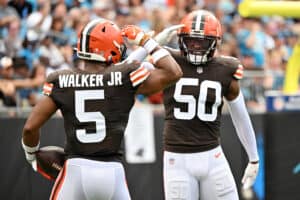 Anthony Walker Jr. #5 of the Cleveland Browns and Jacob Phillips #50 celebrate a defensive play during the second quarter against the Carolina Panthers at Bank of America Stadium on September 11, 2022 in Charlotte, North Carolina.