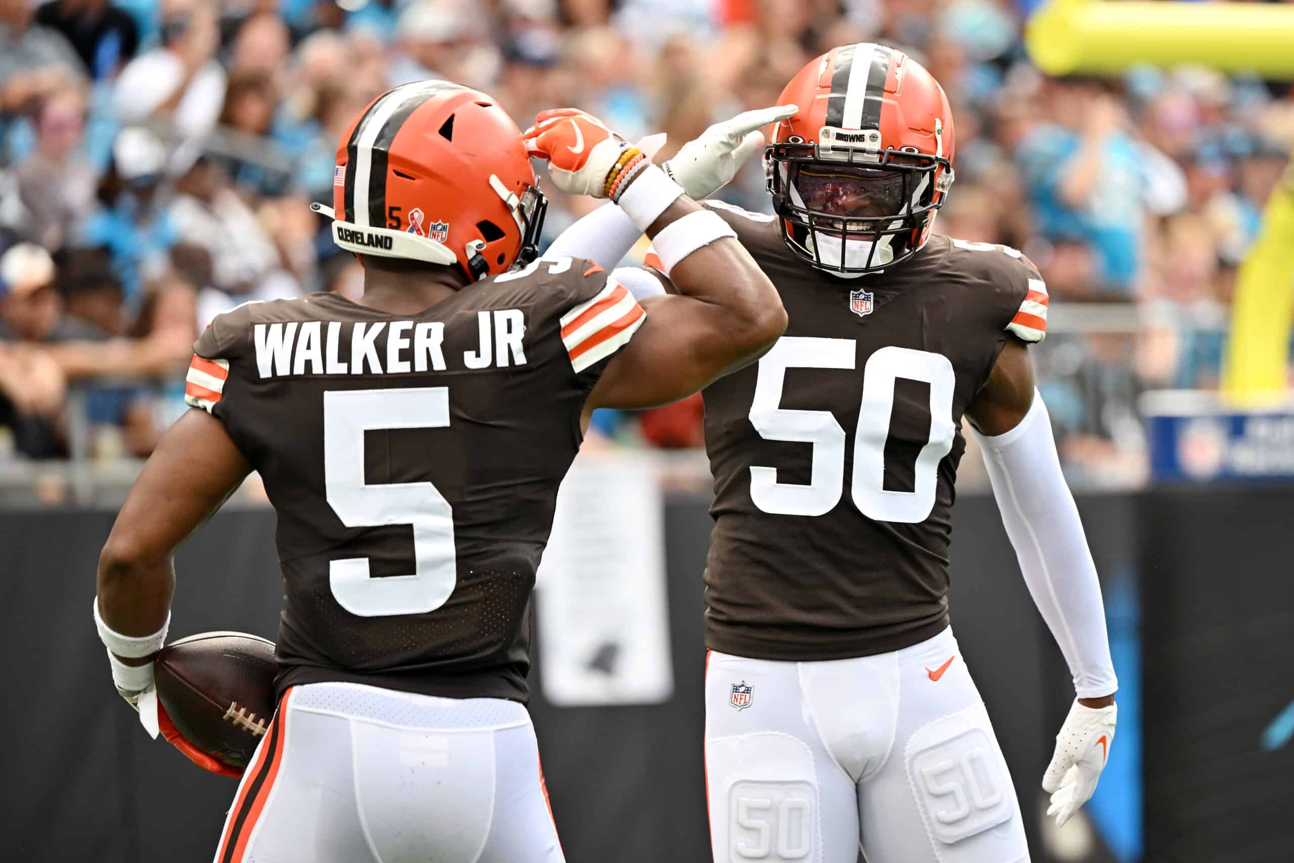 Anthony Walker Jr. #5 of the Cleveland Browns and Jacob Phillips #50 celebrate a defensive play during the second quarter against the Carolina Panthers at Bank of America Stadium on September 11, 2022 in Charlotte, North Carolina.