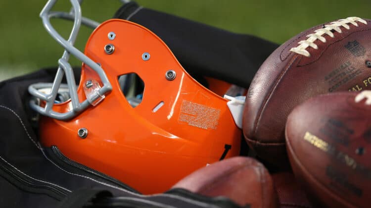 CHICAGO, IL - AUGUST 29: A Cleveland Browns helmet and footballs are seen in a ball bag during a game between the Brown and the Chicago Bears at Soldier Field on August 29, 2013 in Chicago, Illinois. The Browns defeated the Bears 18-16.