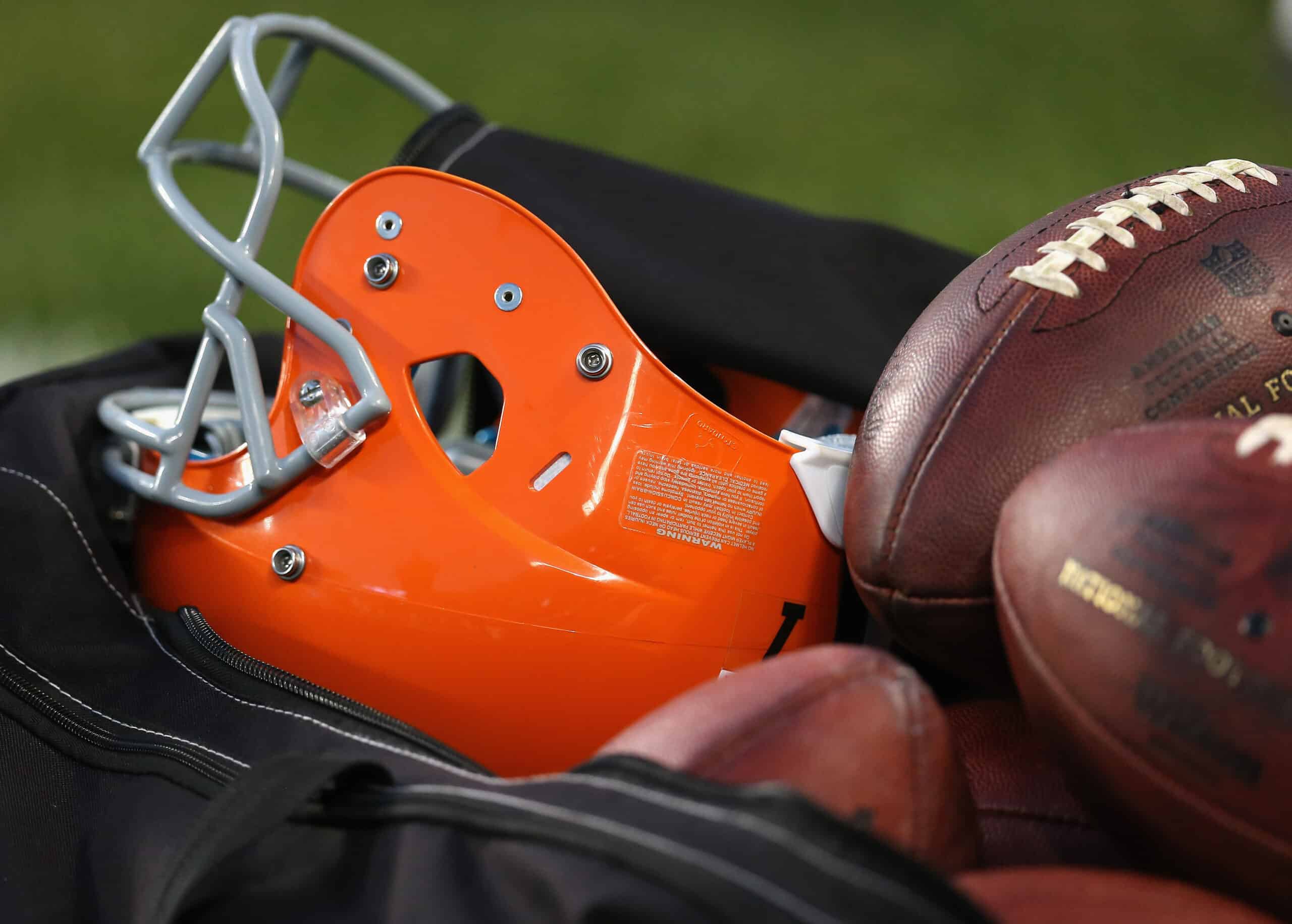 CHICAGO, IL - AUGUST 29:  A Cleveland Browns helmet and footballs are seen in a ball bag during a game between the Brown and the Chicago Bears at Soldier Field on August 29, 2013 in Chicago, Illinois. The Browns defeated the Bears 18-16. 