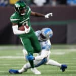 Elijah Moore #8 of the New York Jets carries the ball during the second half of the game against the Detroit Lions at MetLife Stadium on December 18, 2022 in East Rutherford, New Jersey.