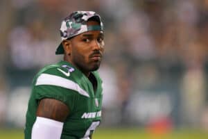 Elijah Moore #8 of the New York Jets looks on from the sidelines against the Philadelphia Eagles in the second half of the preseason game at Lincoln Financial Field on August 12, 2022 in Philadelphia, Pennsylvania. The Jets defeated the Eagles 24-21.