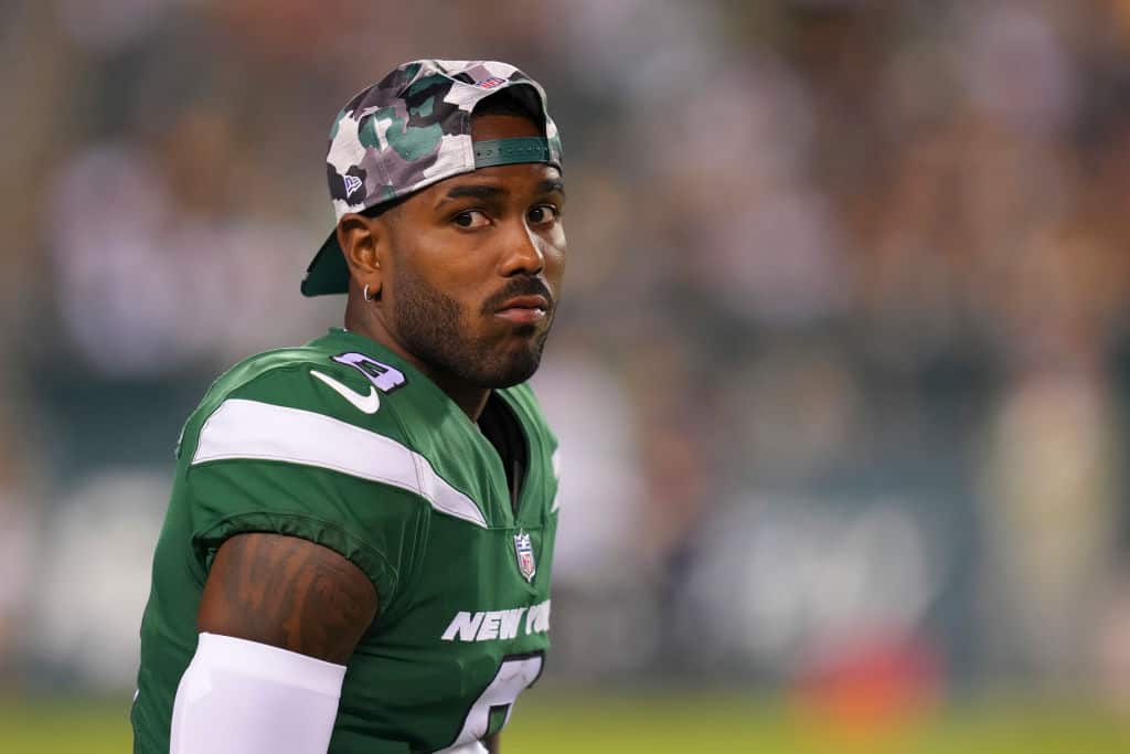 Elijah Moore #8 of the New York Jets looks on from the sidelines against the Philadelphia Eagles in the second half of the preseason game at Lincoln Financial Field on August 12, 2022 in Philadelphia, Pennsylvania. The Jets defeated the Eagles 24-21.