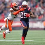 Brandon Bolden #25 of the New England Patriots is tackled by Mack Wilson #51 of the Cleveland Browns during the third quarter at Gillette Stadium on November 14, 2021 in Foxborough, Massachusetts.