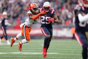 Brandon Bolden #25 of the New England Patriots is tackled by Mack Wilson #51 of the Cleveland Browns during the third quarter at Gillette Stadium on November 14, 2021 in Foxborough, Massachusetts.