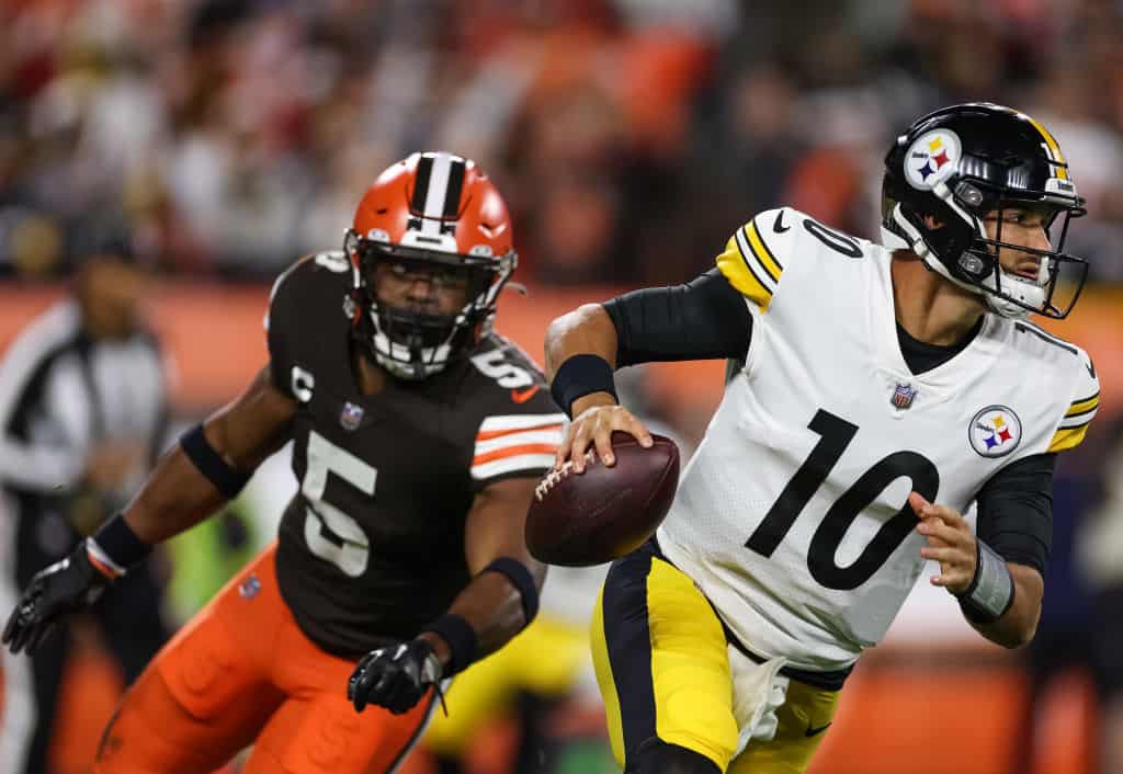 Mitch Trubisky #10 of the Pittsburgh Steelers scrambles from Anthony Walker Jr. #5 of the Cleveland Browns during the first quarter at FirstEnergy Stadium on September 22, 2022 in Cleveland, Ohio.