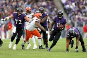 Quarterback Lamar Jackson #8 of the Baltimore Ravens runs with the ball against the Cleveland Browns at M&T Bank Stadium on October 23, 2022 in Baltimore, Maryland.