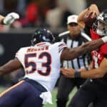 Nicholas Morrow #53 of the Chicago Bears tackles Marcus Mariota #1 of the Atlanta Falcons during the third quarter at Mercedes-Benz Stadium on November 20, 2022 in Atlanta, Georgia.
