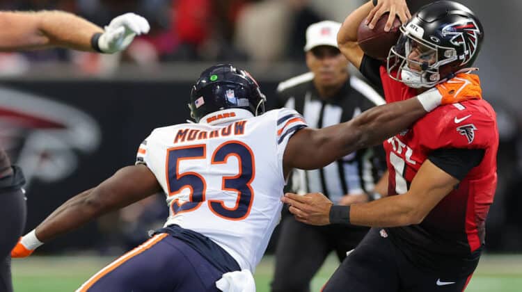 Nicholas Morrow #53 of the Chicago Bears tackles Marcus Mariota #1 of the Atlanta Falcons during the third quarter at Mercedes-Benz Stadium on November 20, 2022 in Atlanta, Georgia.
