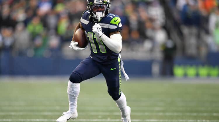 Marquise Goodwin #11 of the Seattle Seahawks runs with the ball in the fourth quarter against the Las Vegas Raiders at Lumen Field on November 27, 2022 in Seattle, Washington.