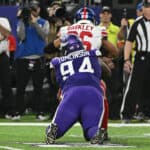 Dalvin Tomlinson #94 of the Minnesota Vikings tackles Saquon Barkley #26 of the New York Giants for a loss during the third quarter in the NFC Wild Card playoff game at U.S. Bank Stadium on January 15, 2023 in Minneapolis, Minnesota.