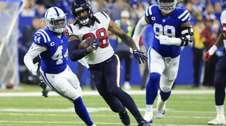 Jordan Akins #88 of the Houston Texans runs with the ball during the first half of the game against the Indianapolis Colts at Lucas Oil Stadium on January 08, 2023 in Indianapolis, Indiana.