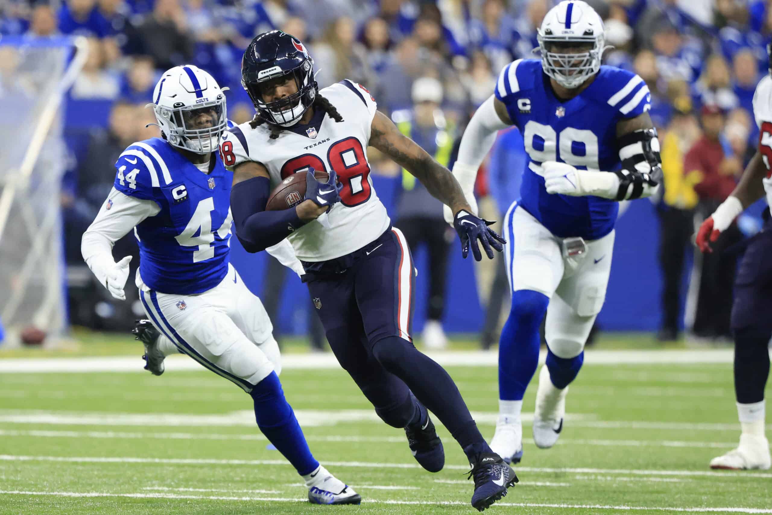 Jordan Akins #88 of the Houston Texans runs with the ball during the first half of the game against the Indianapolis Colts at Lucas Oil Stadium on January 08, 2023 in Indianapolis, Indiana.