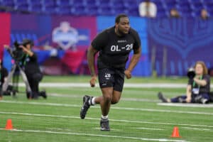 Dawand Jones of Ohio State participates in a drill during the NFL Combine at Lucas Oil Stadium on March 05, 2023 in Indianapolis, Indiana.