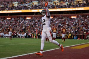 Michael Woods II #12 of the Cleveland Browns reacts after the Cleveland Browns scored a touchdown during the fourth quarter against the Washington Commanders at FedExField on January 01, 2023 in Landover, Maryland.