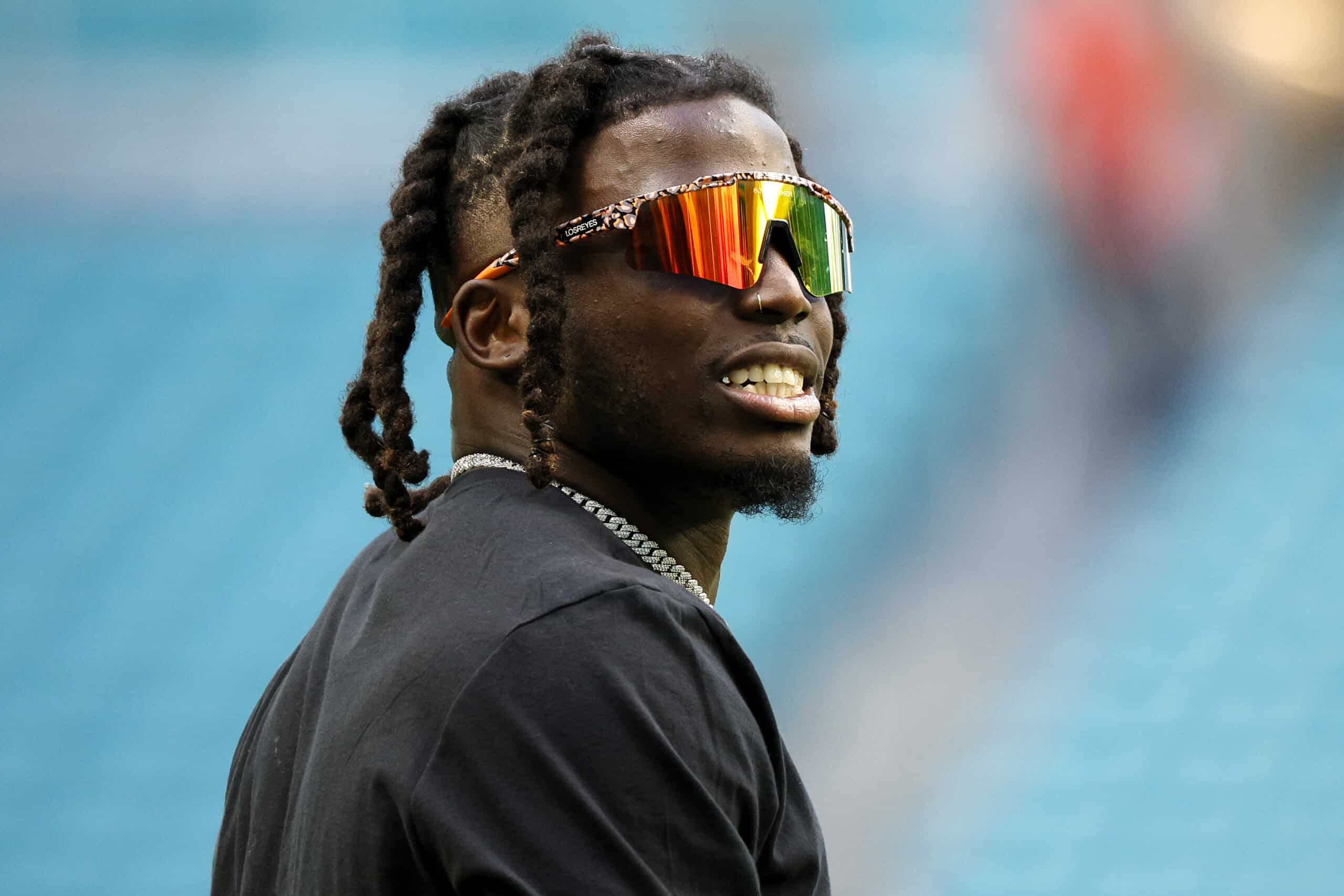 Tyreek Hill #10 of the Miami Dolphins warms up prior to a game against the New York Jets while wearing a shirt in support of Buffalo Bills safety Damar Hamlin at Hard Rock Stadium on January 08, 2023 in Miami Gardens, Florida. Hamlin suffered cardiac arrest during the Bills' Monday Night Football game against the Cincinnati Bengals and remains in intensive care.