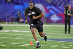 Dawand Jones of Ohio State participates in a drill during the NFL Combine at Lucas Oil Stadium on March 05, 2023 in Indianapolis, Indiana.