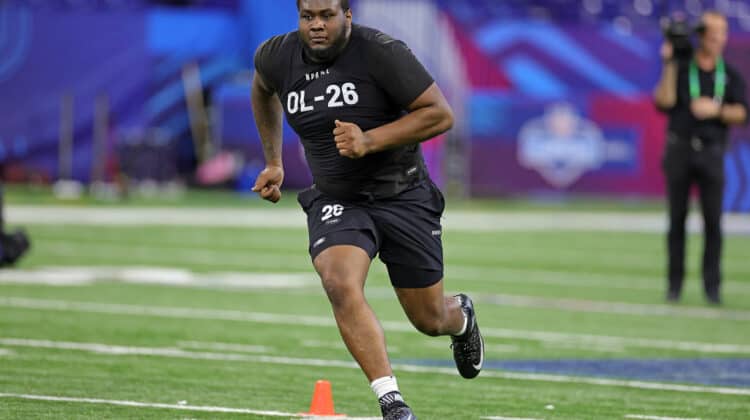 Dawand Jones of Ohio State participates in a drill during the NFL Combine at Lucas Oil Stadium on March 05, 2023 in Indianapolis, Indiana.