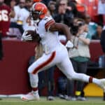 Amari Cooper #2 of the Cleveland Browns scores a touchdown on a 33 yard pass during the fourth quarter against the Washington Commanders at FedExField on January 01, 2023 in Landover, Maryland.