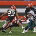 Boston Scott #35 of the Philadelphia Eagles is pursued by Andrew Sendejo #23 of the Cleveland Browns during the first half at FirstEnergy Stadium on November 22, 2020 in Cleveland, Ohio.