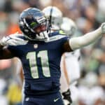 Marquise Goodwin #11 of the Seattle Seahawks reacts during the third quarter against the Las Vegas Raiders at Lumen Field on November 27, 2022 in Seattle, Washington.