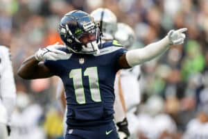 Marquise Goodwin #11 of the Seattle Seahawks reacts during the third quarter against the Las Vegas Raiders at Lumen Field on November 27, 2022 in Seattle, Washington.