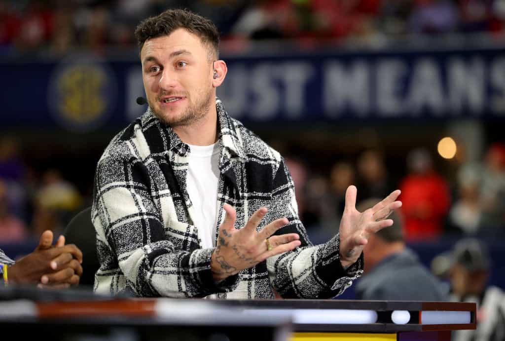 Football Quarterback Johnny Manziel talks onset prior to the SEC Championship game between the LSU Tigers and the Georgia Bulldogs at Mercedes-Benz Stadium on December 03, 2022 in Atlanta, Georgia.