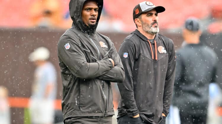 Deshaun Watson #4 stands on the field with head coach Kevin Stefanski of the Cleveland Browns prior to the start of a preseason game against the Philadelphia Eagles at FirstEnergy Stadium on August 21, 2022 in Cleveland, Ohio.