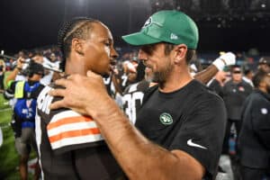 Dorian Thompson-Robinson #17 of the Cleveland Browns talks with Aaron Rodgers #8 of the New York Jets after the Browns defeated the Jets 21-16 in the 2023 Pro Hall of Fame Game at Tom Benson Hall Of Fame Stadium on August 3, 2023 in Canton, Ohio.